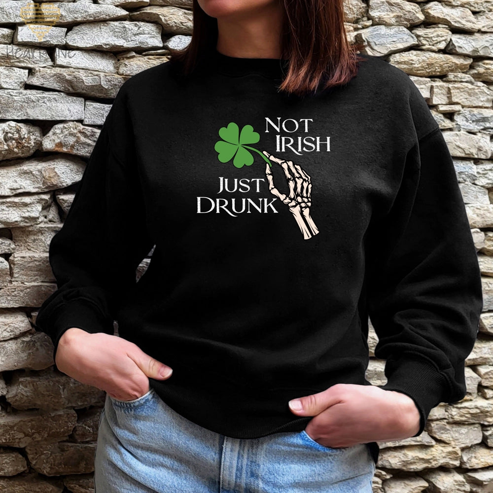 Black Sweatshirt with skeleton hand holding a four-leaf clover that says 'Not Irish Just Drunk' in a distressed text.