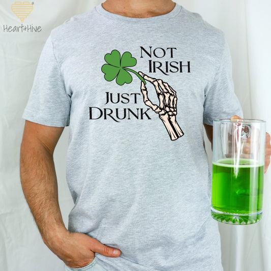 Athletic Heather Grey Tee with skeleton hand holding a four-leaf clover that says 'Not Irish Just Drunk' in a distressed text.