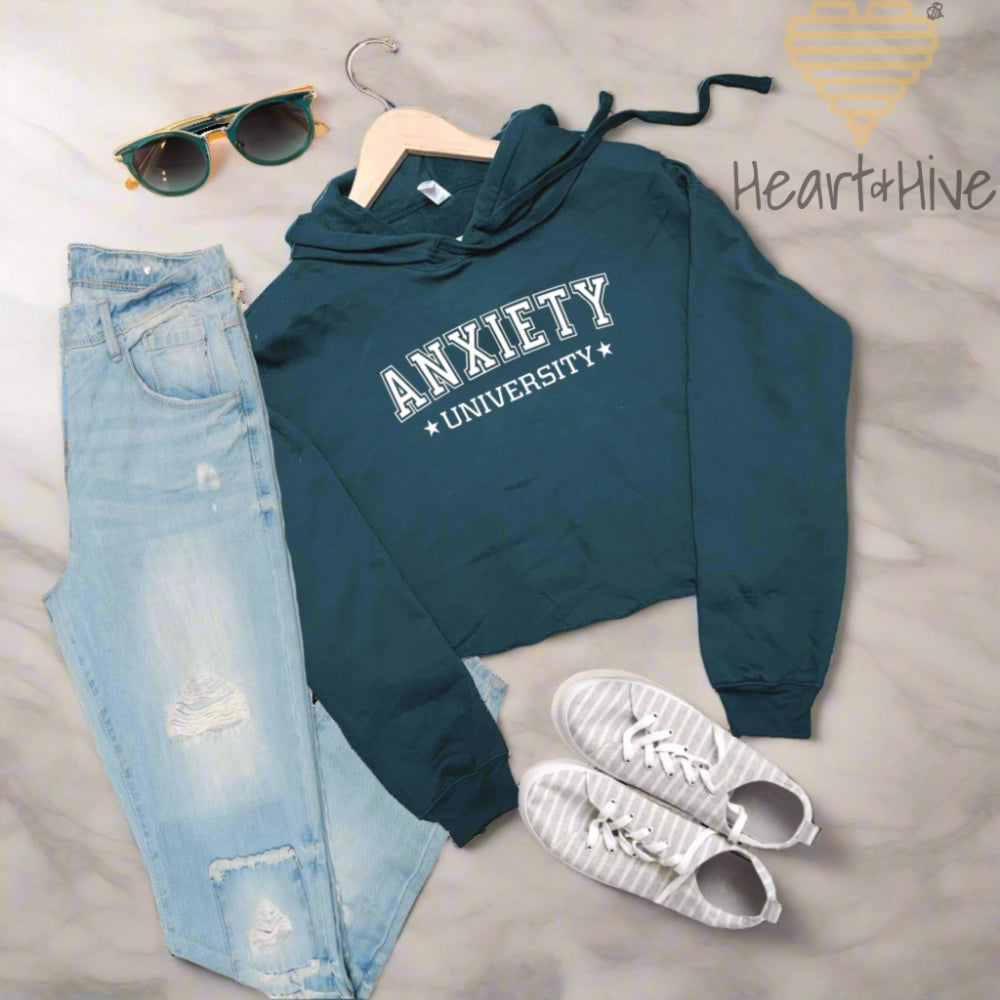 Atlantic cropped fleece hoodie with 'Anxiety University' in bold, white collegiate font, framed by small stars on each side.