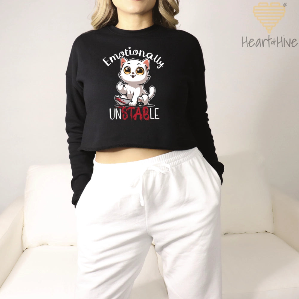 Black crop sweatshirt with a white cat holding a bloody knife with his middle finger up. 'Emotionally' is rounded above and unstable is written below with 'stab' red and dripping.