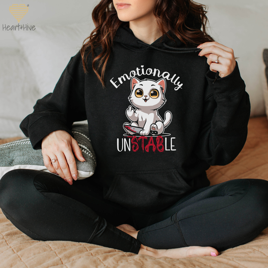 Black hoodie with a white cat holding a bloody knife with his middle finger up. 'Emotionally' is rounded above and unstable is written below with 'stab' red and dripping.