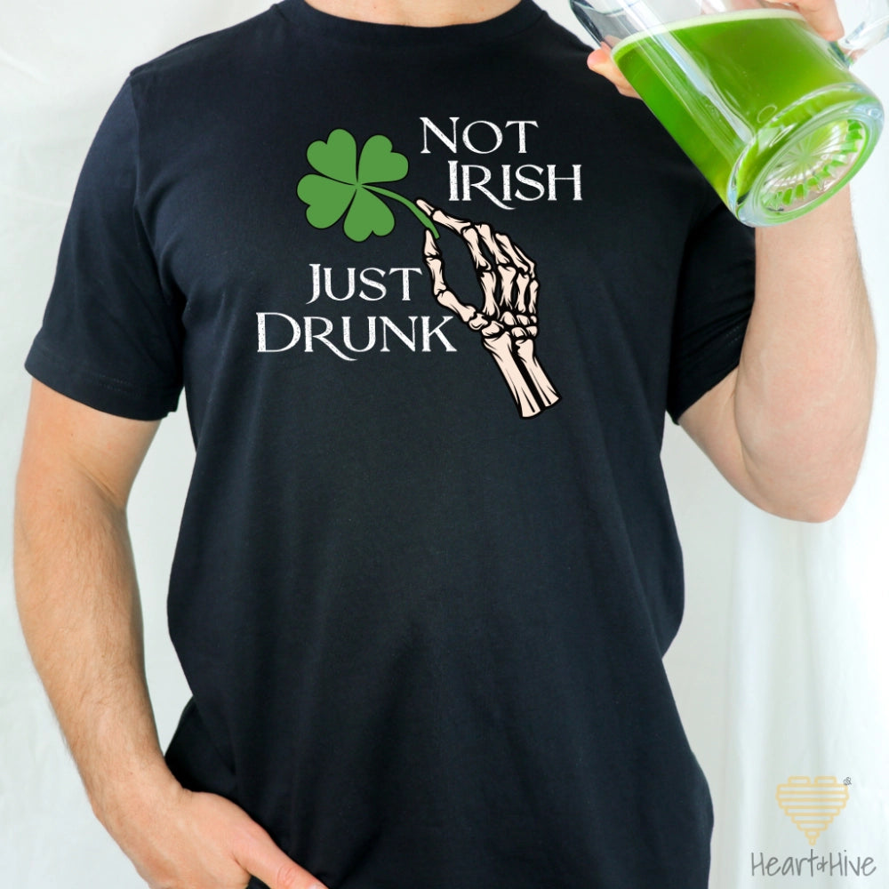 Black Tee with skeleton hand holding a four-leaf clover that says 'Not Irish Just Drunk' in a distressed text.