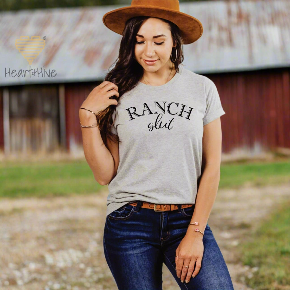Athletic Heather Grey tee with, 'Ranch Slut' with Ranch written in a Western font and slut written in a cute cursive text. 
