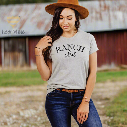 Athletic Heather Grey tee with, 'Ranch Slut' with Ranch written in a Western font and slut written in a cute cursive text. 